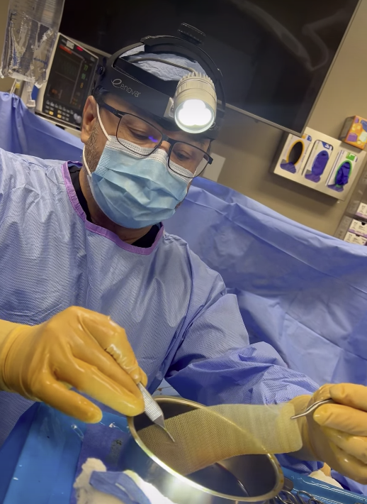 Dr. Guerra pulling out surgical mesh