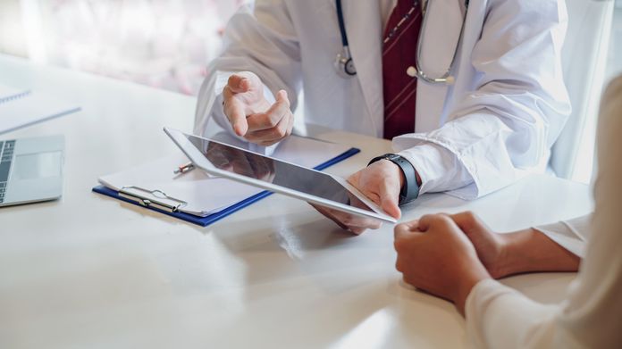 doctor holding pad