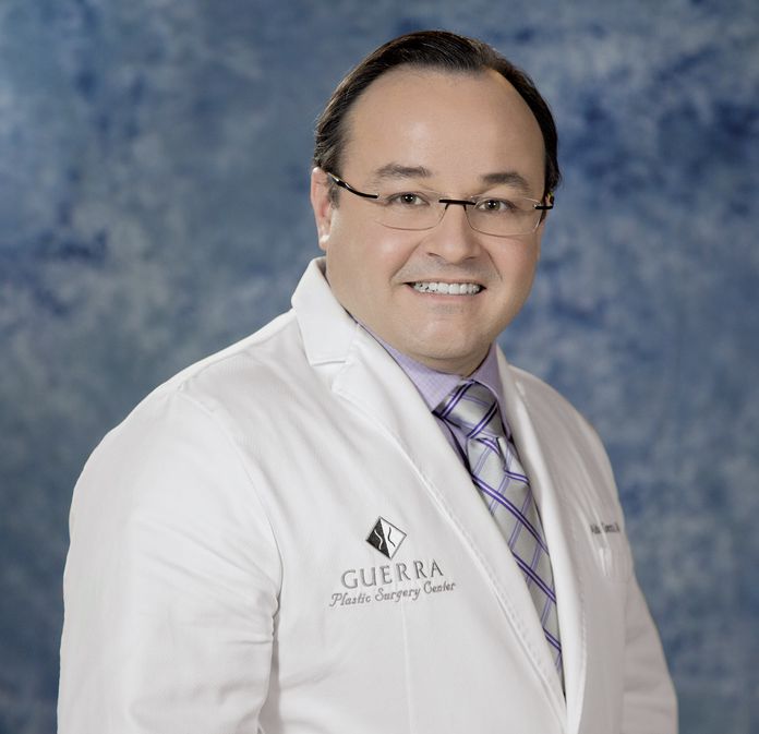 Dr. Guerra wearing white coat