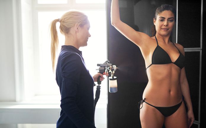 woman getting a spray tan