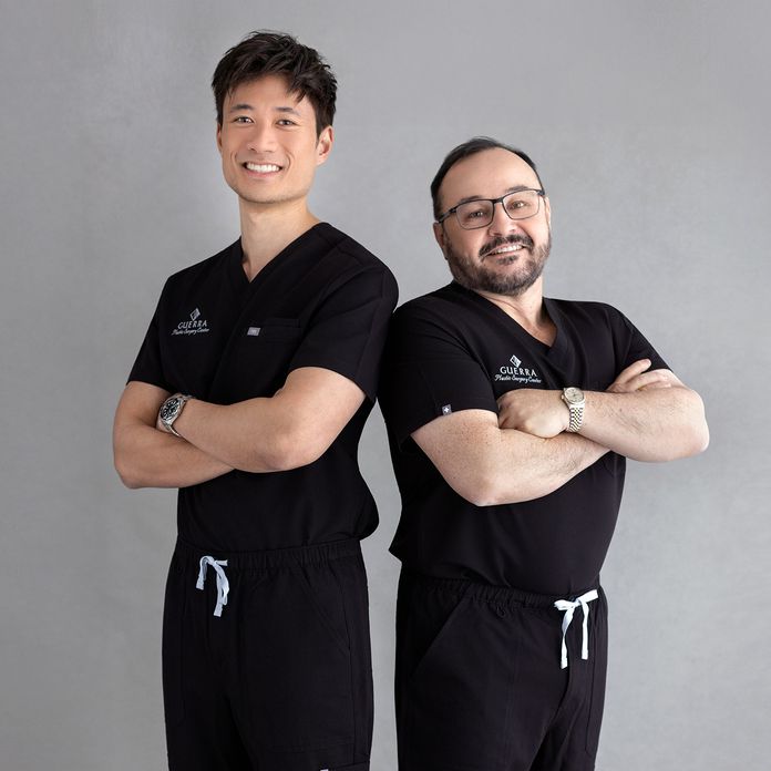 Dr. Dang and Dr. Guerra standing in black scrubs